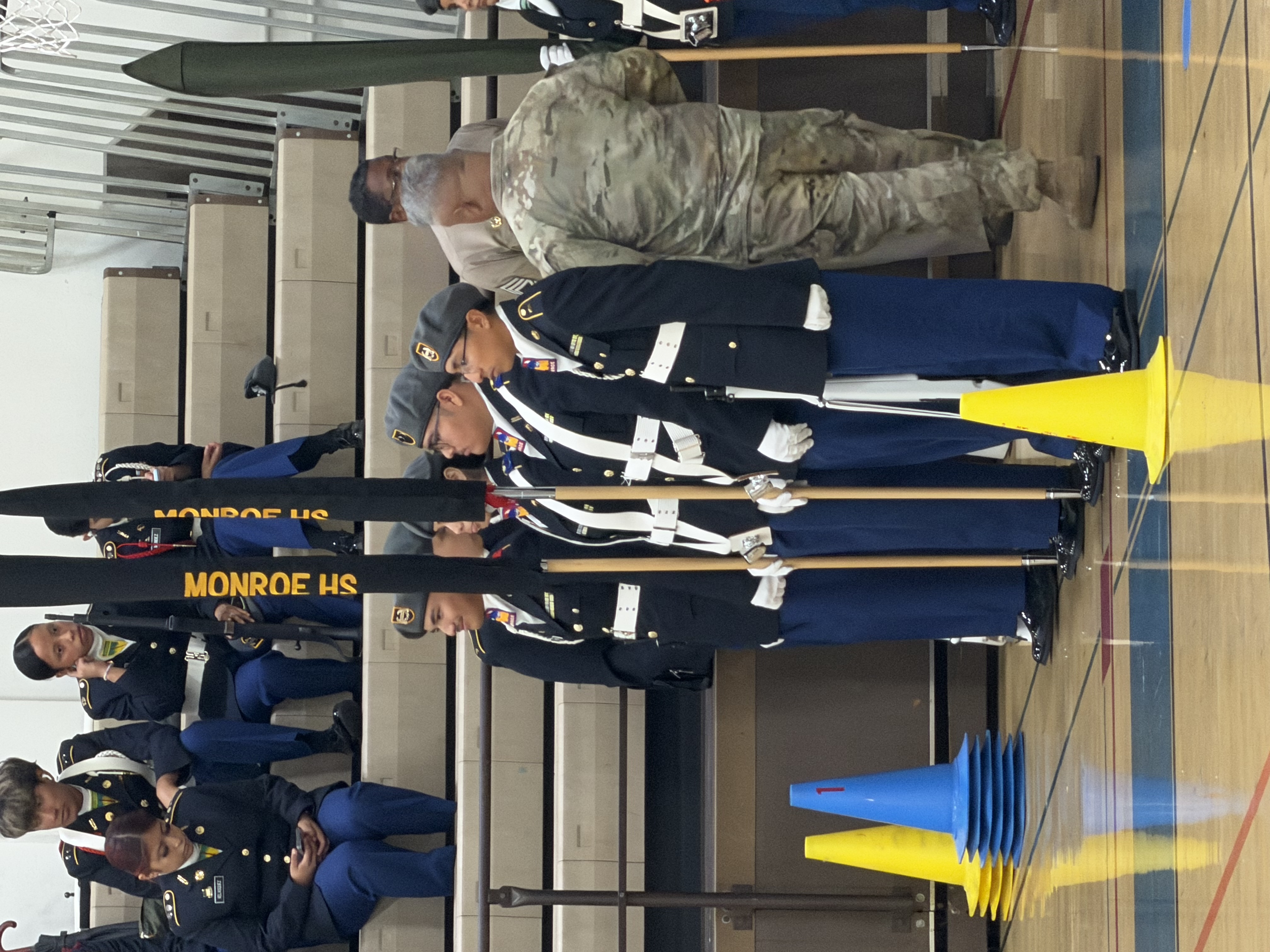 Color Guard team at attention with rifles